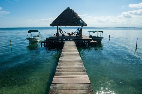 Picture of a dock and a hut showing large depth of field. Photo by Eduardo Libby