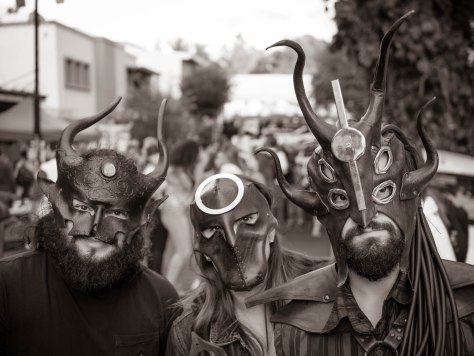Leather mask vendors modelling their product. Photo by Eduardo Libby