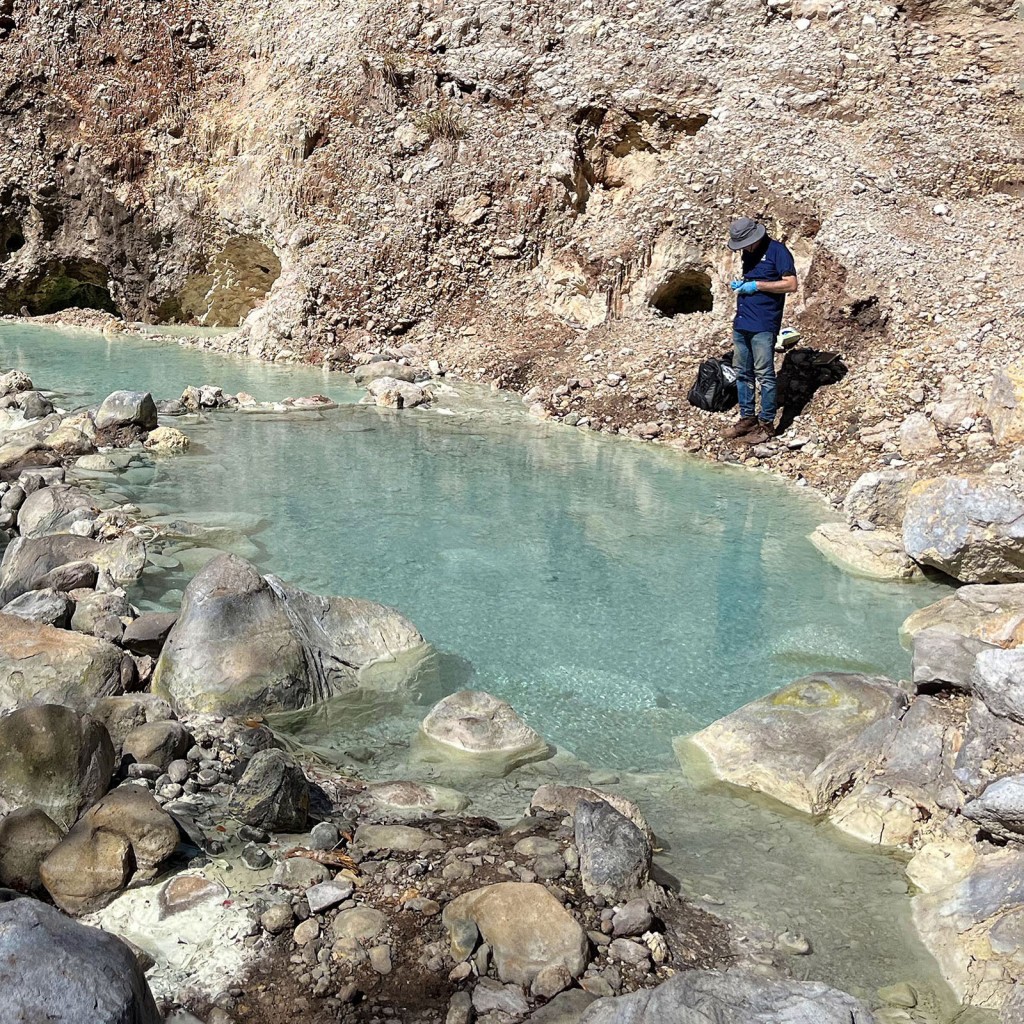 A scientist at a hydrothermal water source in Costa Rica